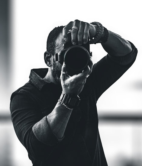 black and white shot of photographer taking photo